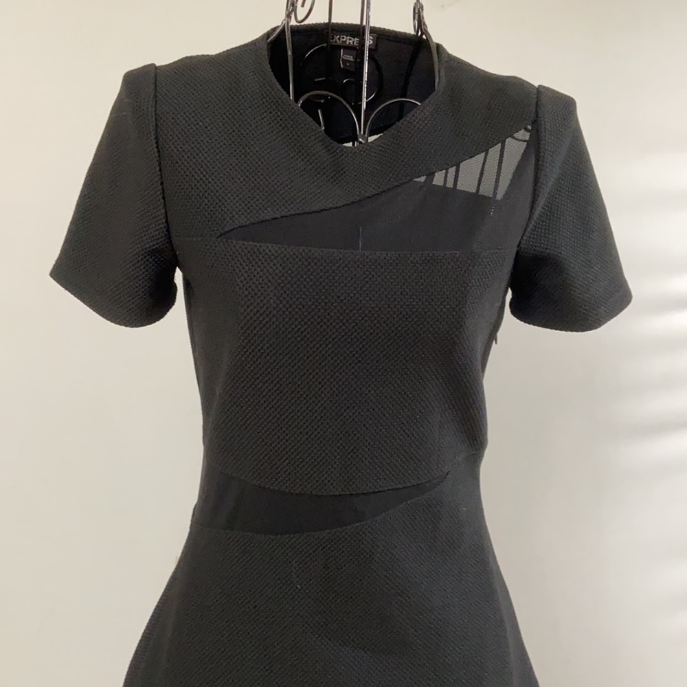 Black body con dress with peekaboo mesh panels. Perfect LBD